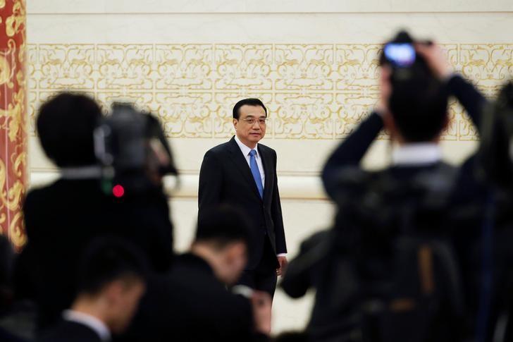 China's premier says no hard landing, but growth target not easy