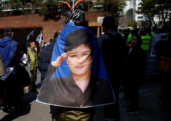 South Korea's Park criticized over defiance, faces calls for investigation