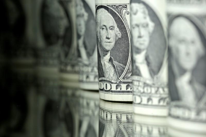 Dollar steadies after Fed skid, shares hit new highs