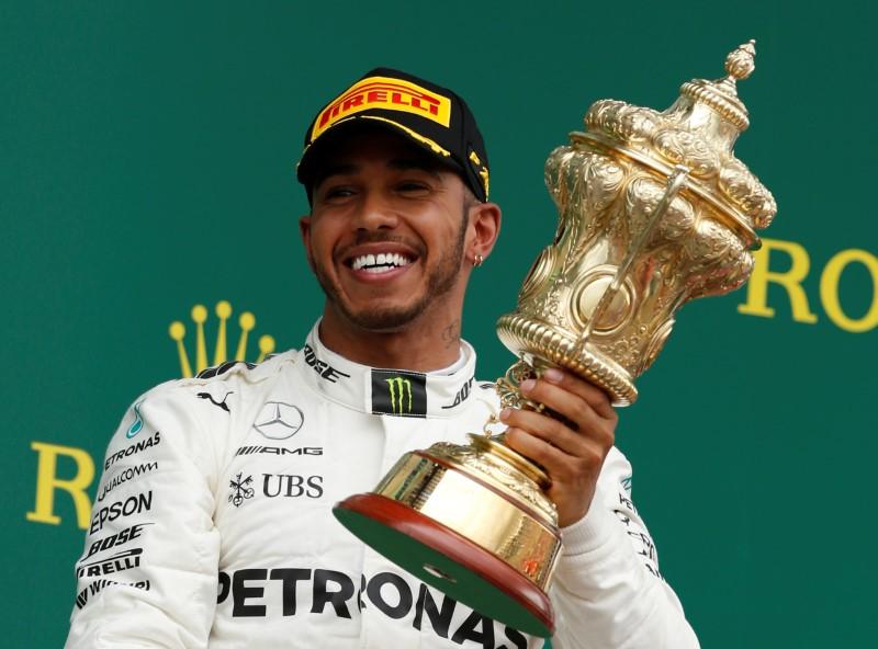 Hamilton slashes Vettel's lead to win British Grand Prix