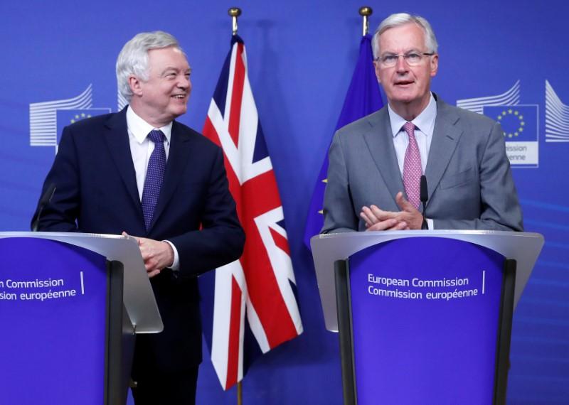 As London squabbles, full Brexit talks start in Brussels