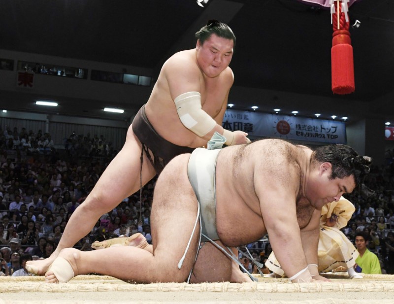 Mongolian Hakuho smashes sumo record with 1,048th win