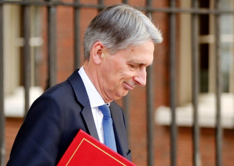 Inflation hits UK public finances in June, adding to Hammond's headache