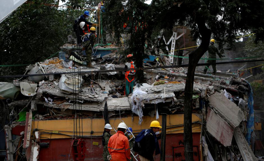 Mexico rescuers work into night to save trapped girl as quake toll tops 230