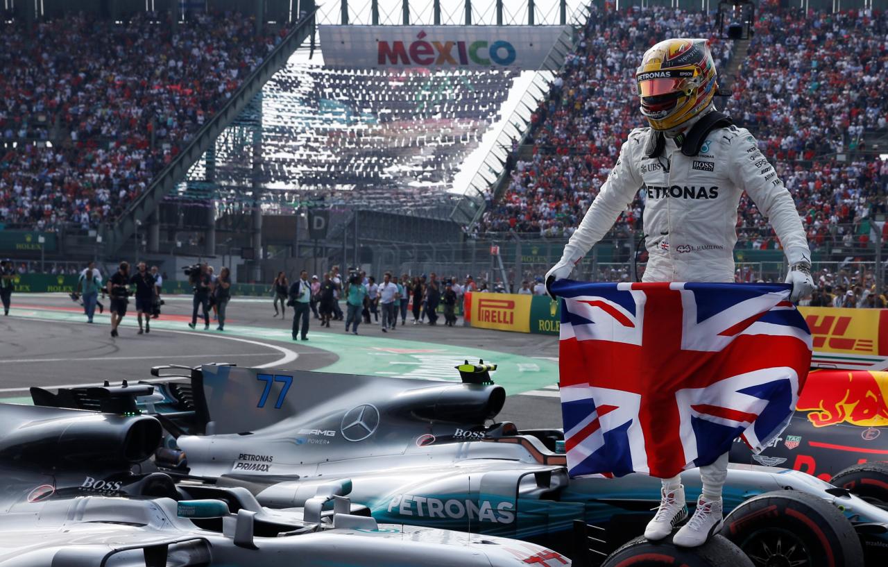 Racing: Hamilton takes fourth title despite collision