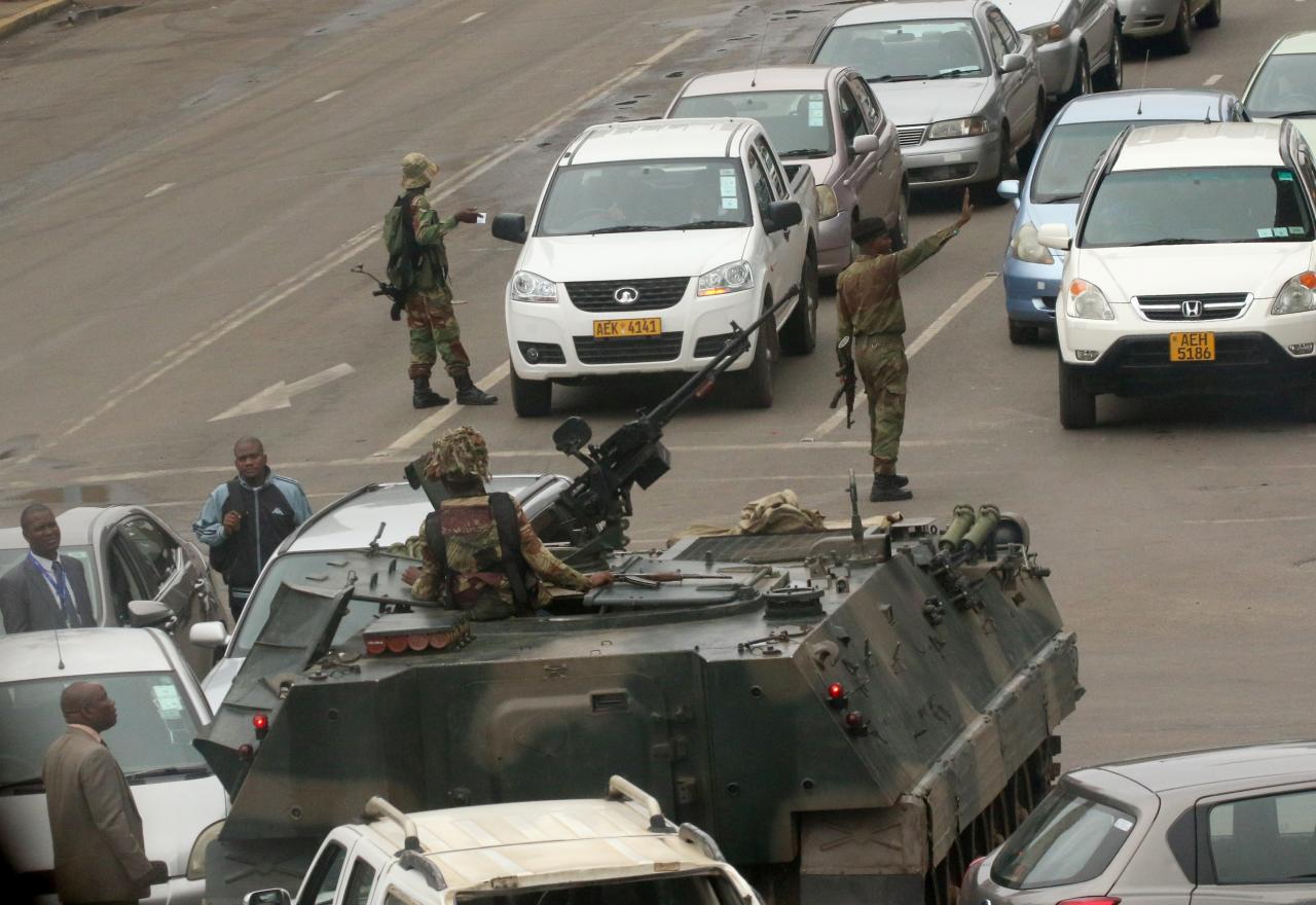 Zimbabwe army launches takeover, Mugabe 'safe and sound'