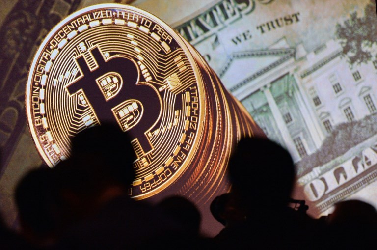 Bitcoin tops $10,000, marks 10-fold increase in 2017