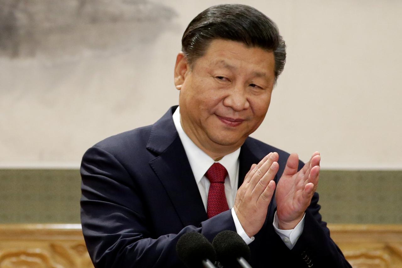 Promote peace, China's Xi tells soldiers at first overseas base