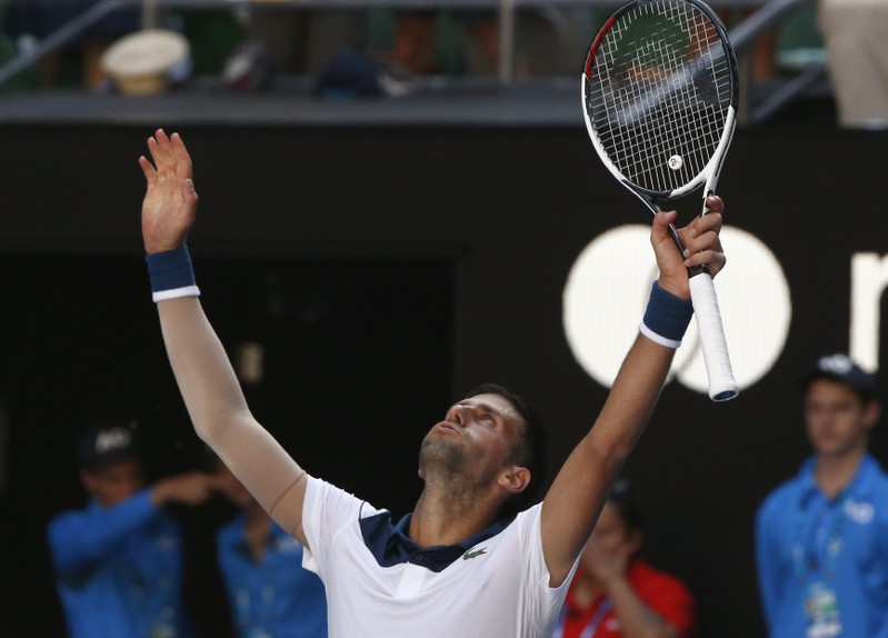 Djokovic survives Melbourne furnace to beat Monfils