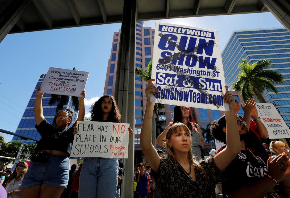 Firearms debate rages as Florida rally coincides with gun show