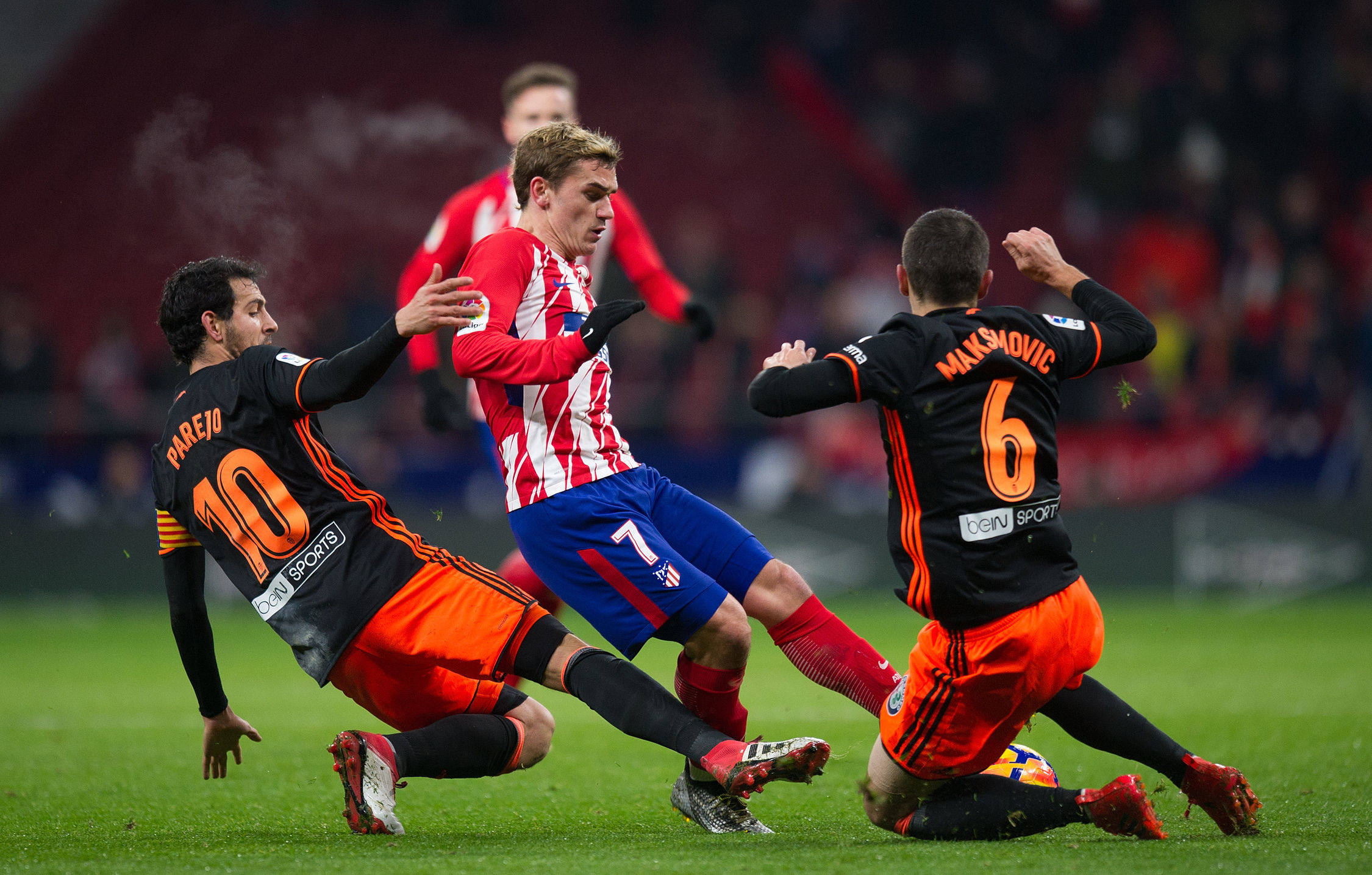 Atletico see off Valencia to close gap on Barca