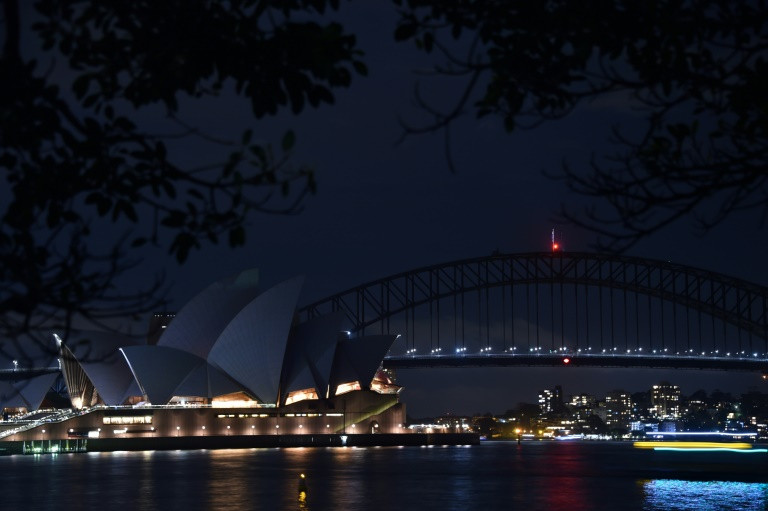 World cities go dark as Earth Hour climate campaign circles globe