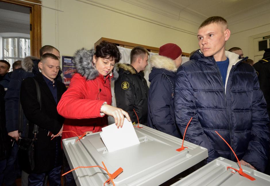 Putin on track for commanding win as Russians head to polls