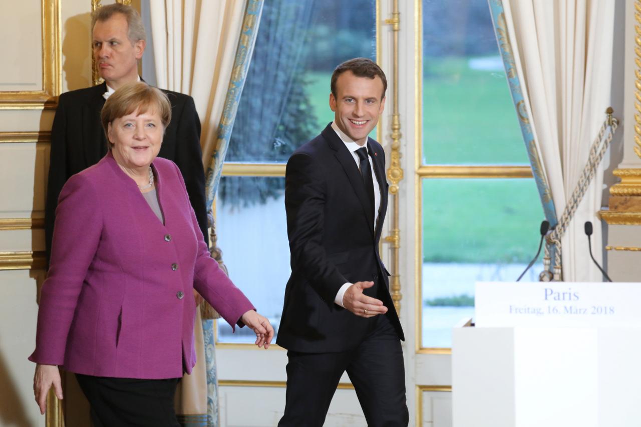 Merkel, Macron plan roadmap by June on euro zone reform