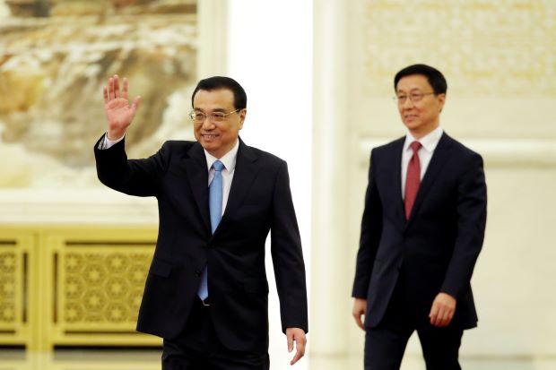 China to complete formation of new government departments by mid-April