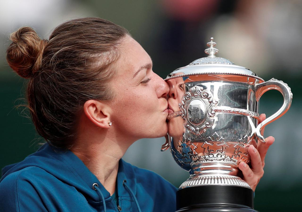 Halep fights back to finally clinch French Open title