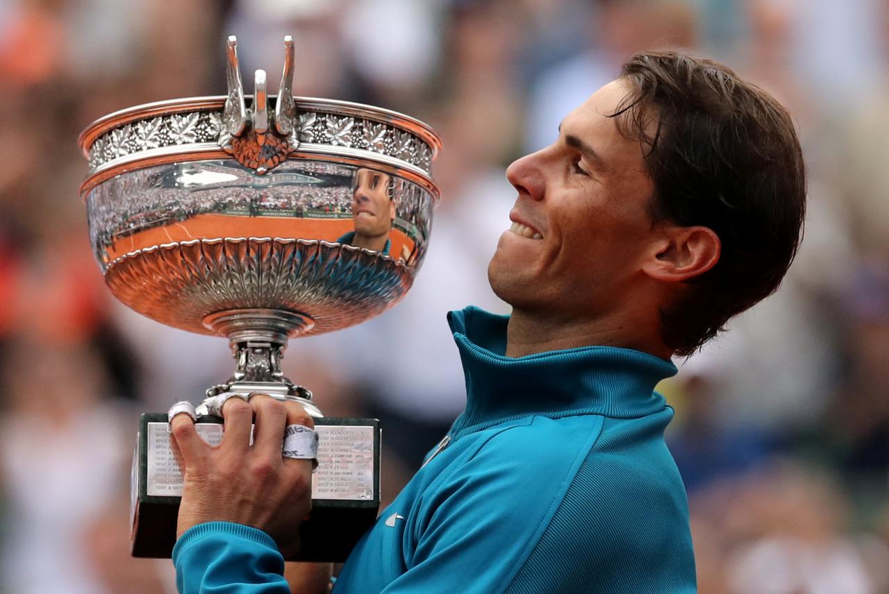 Nadal scales heights again to claim 11th French title