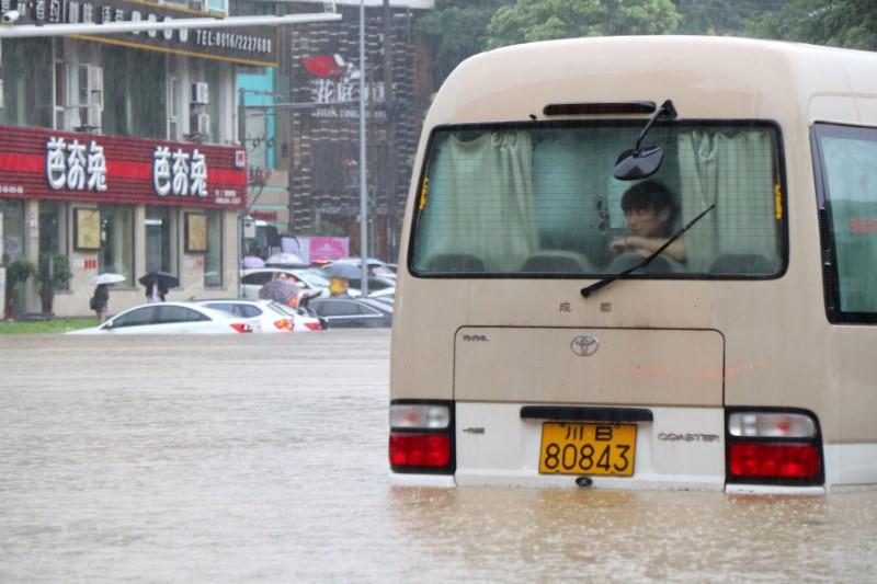 China floods wreak havoc, block roads and railways; more rain due