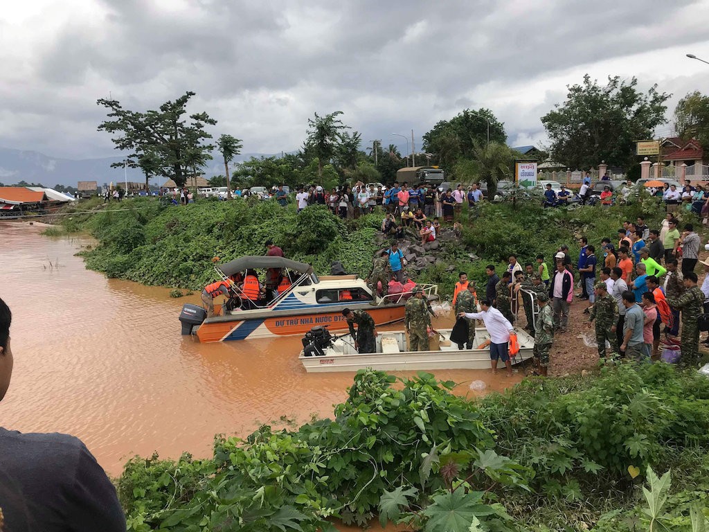 After dam burst in Laos, a scramble for food, medicines and coffins