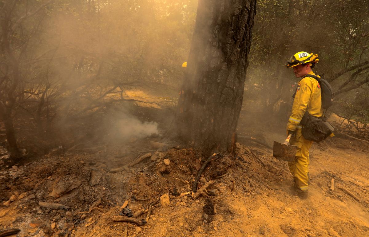 Firefighters gain on sprawling California wildfire, six dead
