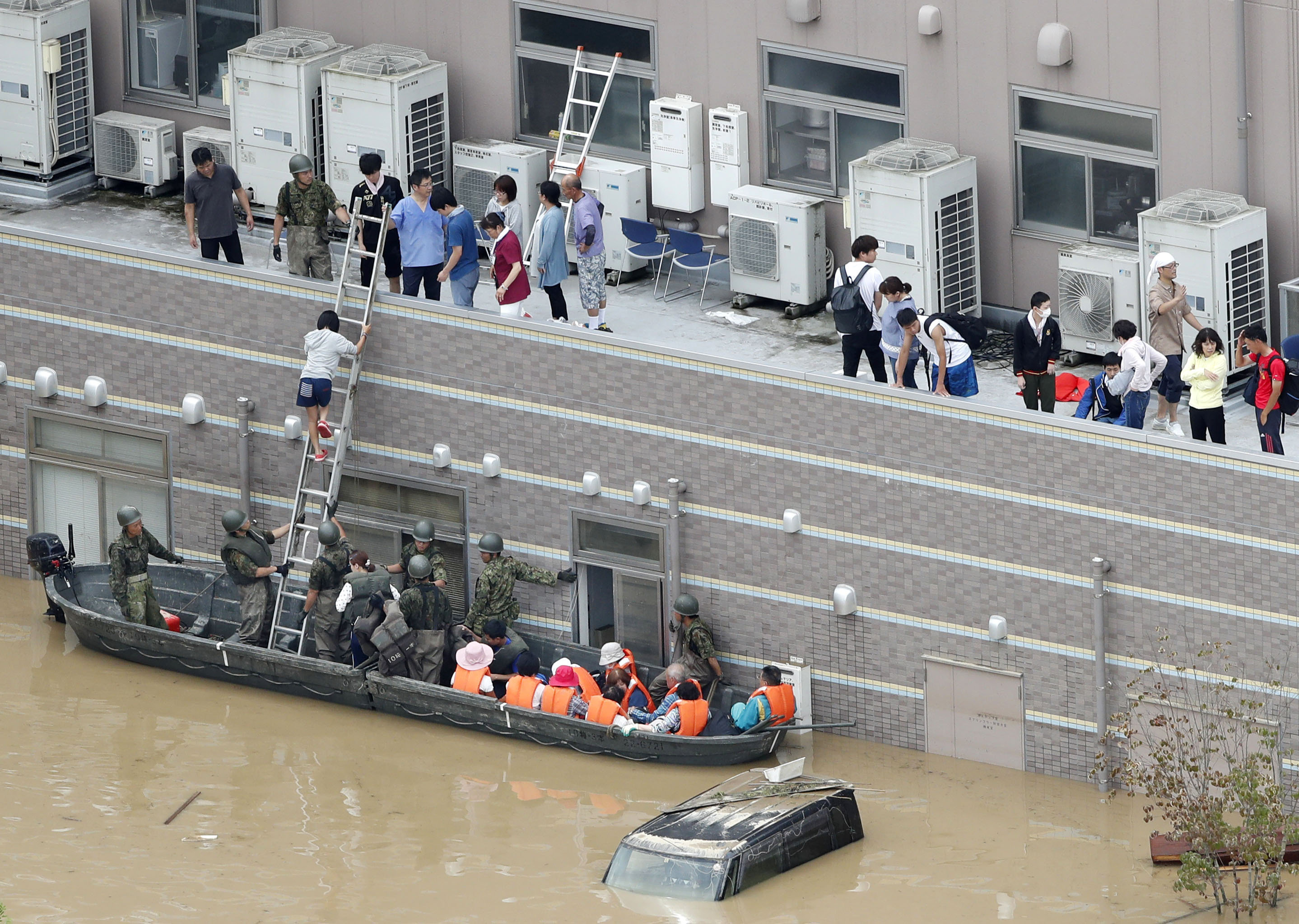 At least 62 dead in Japan after 'unprecedented' rain, dozens missing