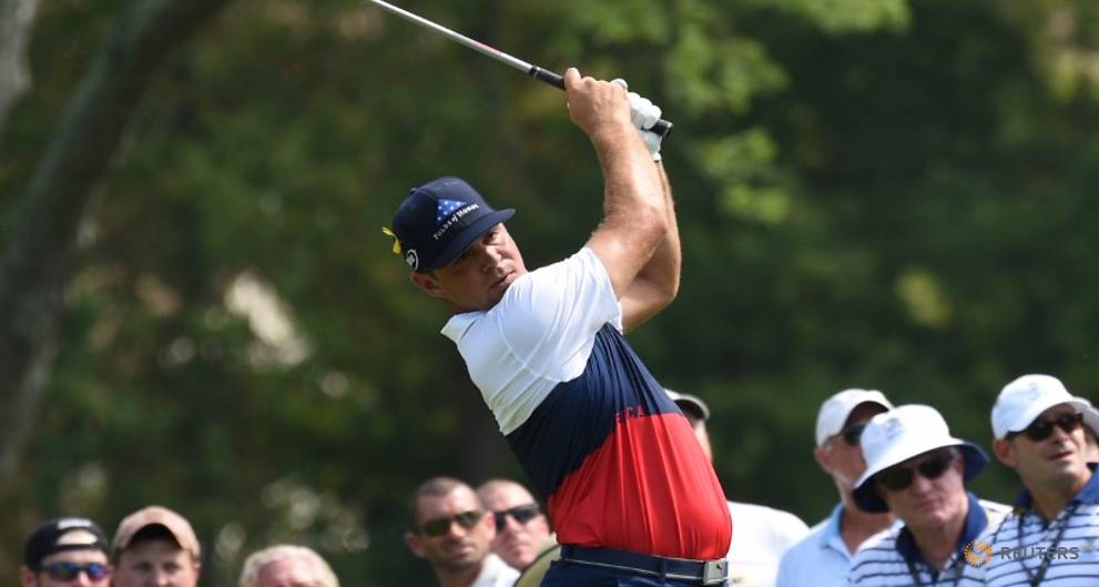 Golf - Woodland chops away to take lead at PGA Championship