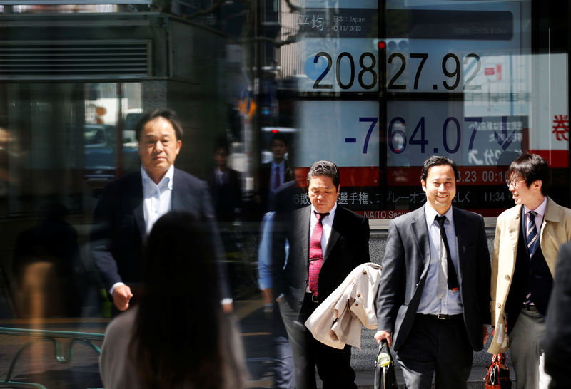 Asian shares rise after record highs on Wall Street