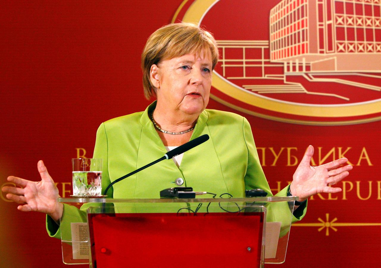 Merkel targets debt reduction, investment as tax take 'very good'
