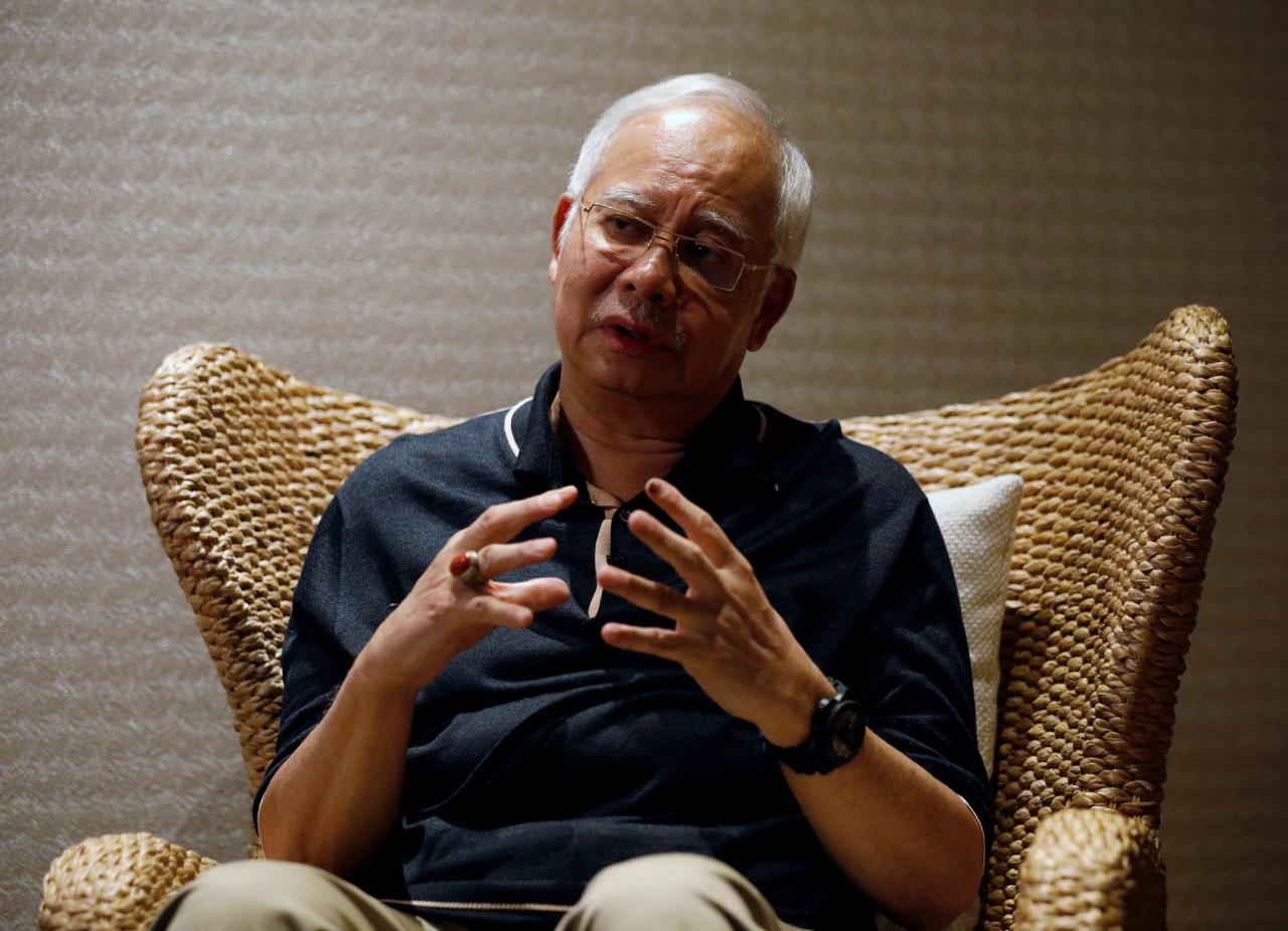 Former Malaysian PM Najib Razak to face 21 money laundering charges: police