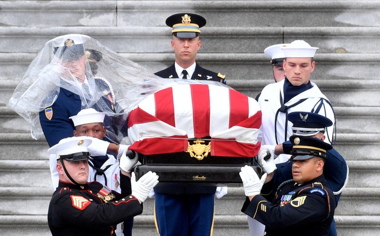 As fighter jets streak overhead, McCain is buried in Annapolis