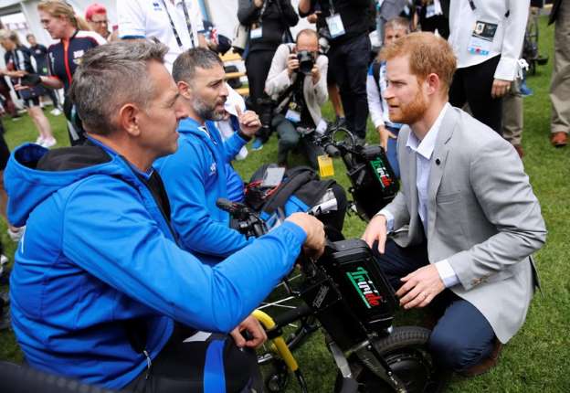 Prince Harry inspires athletes as Meghan trims Australia schedule