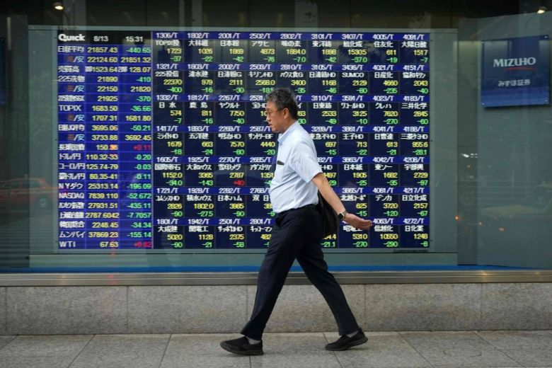 Dollar at one week high after hawkish Fed minutes; Asia stocks capped