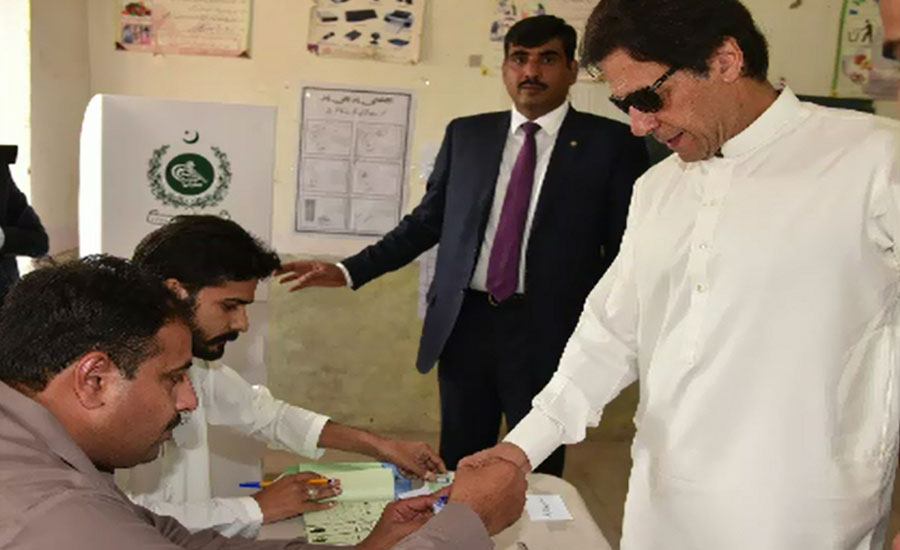 PM including other politicians, candidates cast vote in by election