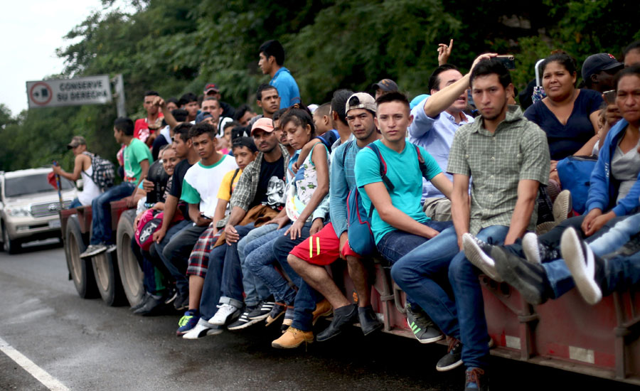 More Honduran migrants seek to join US-bound group in Guatemala