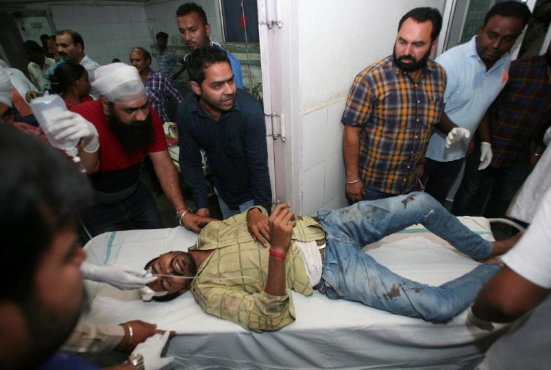 At least 59 killed as train hits crowd in northern India