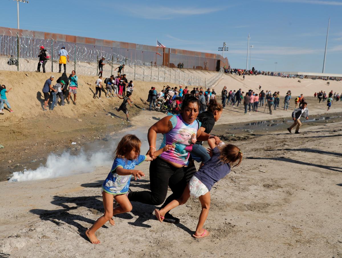 US fires tear gas into Mexico to repel migrants, closes border gate for several hours
