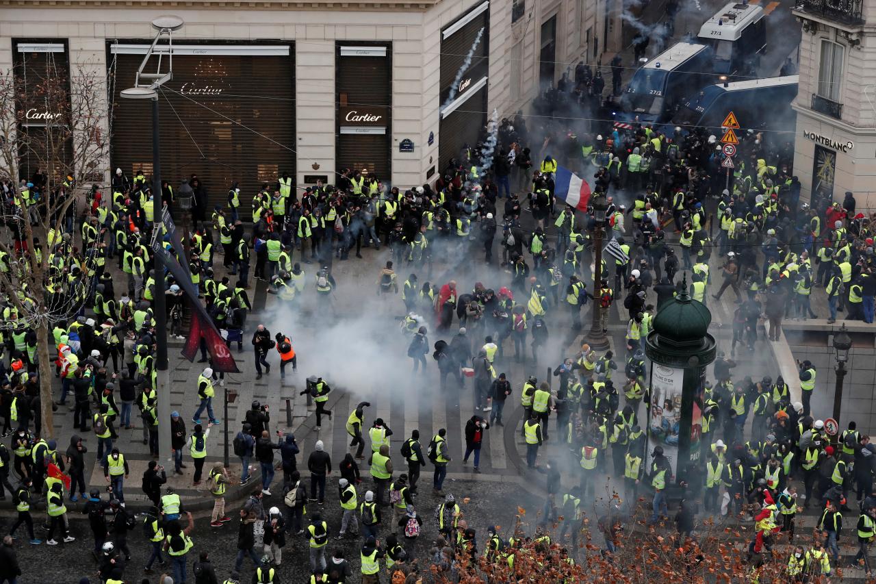 French police use tear gas against protesters in central Paris