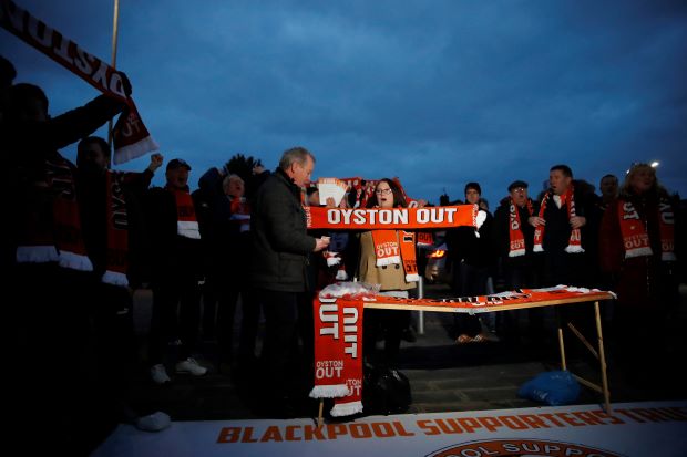 Blackpool fan protests on roof of Arsenal team bus