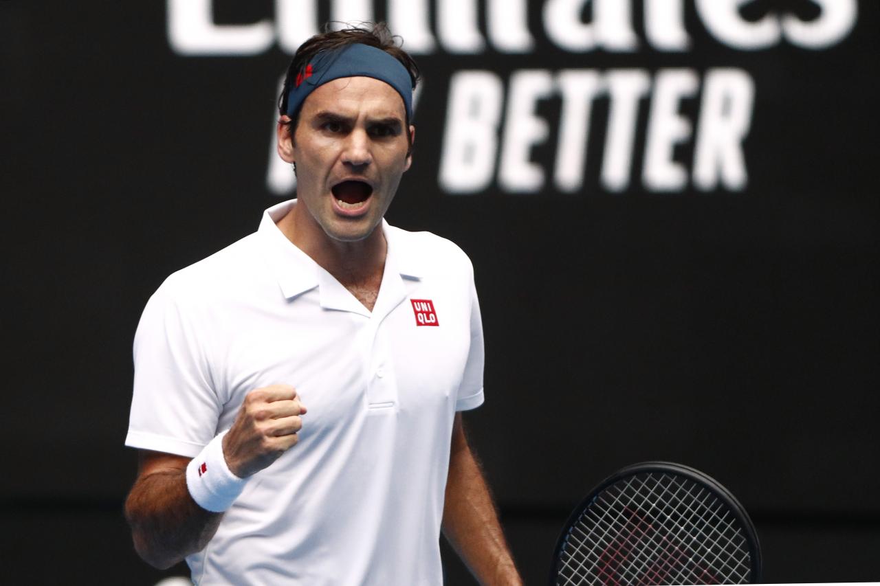 Federer fends off British 'mirror' Evans to advance in Australian Open