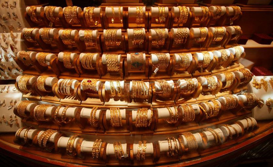 Gold firm near 7-month peak on US rate pause hopes