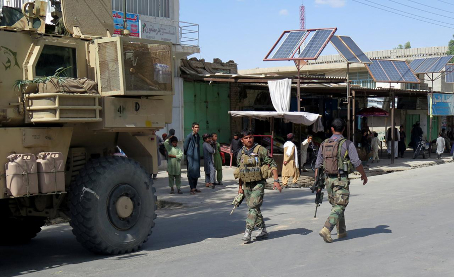 Afghan Taliban kill at least 12 in car bomb attack on military base
