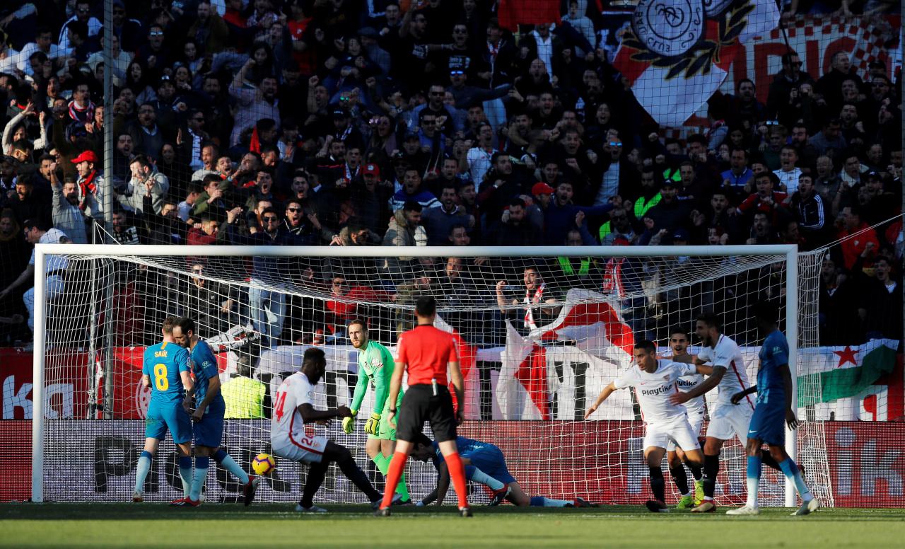 Soccer: Griezmann special earns Atletico 1-1 draw at Sevilla