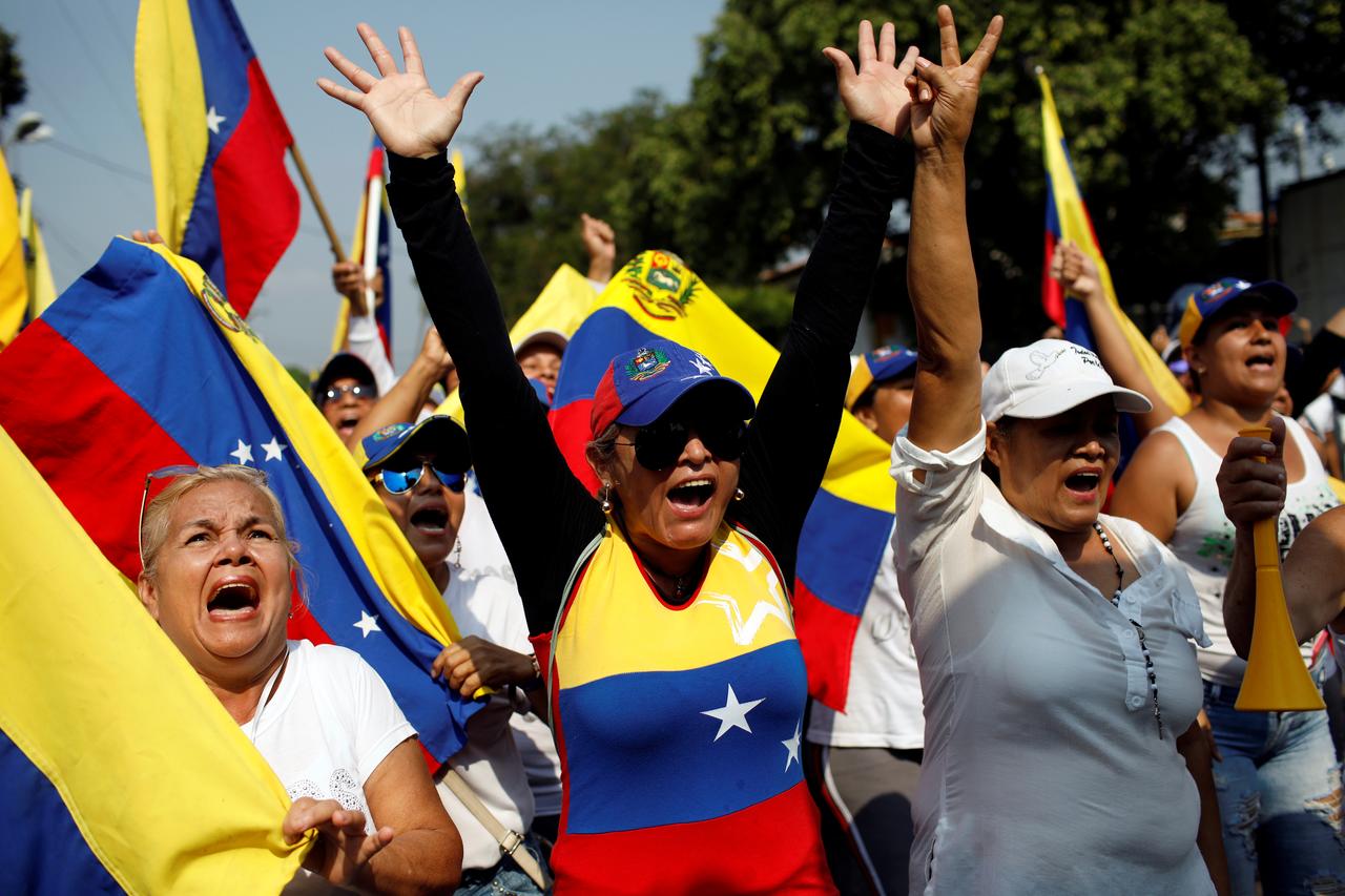 Let aid in, Venezuelan opposition tells Maduro in street rallies