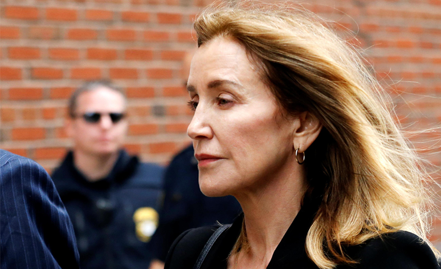 Tearful Felicity Huffman admits role in US college admissions scandal