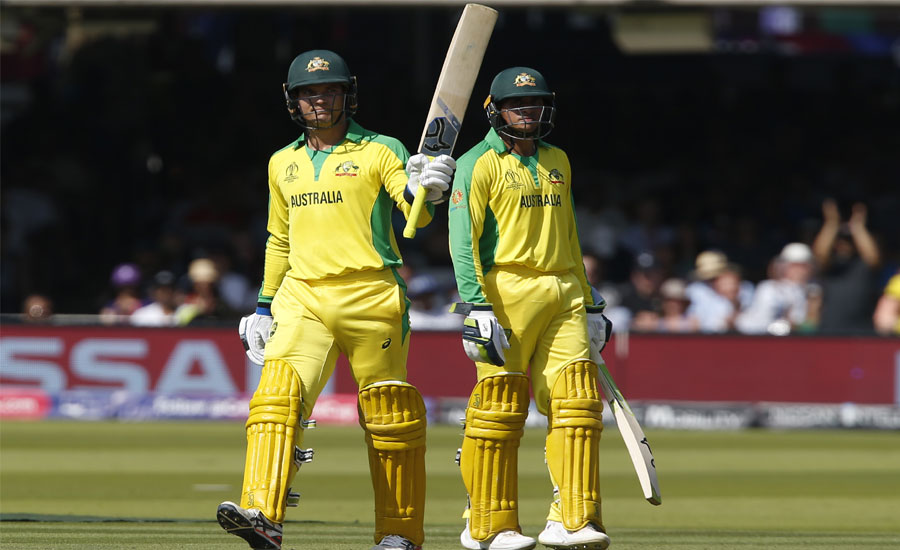 Carey and Khawaja half-centuries, Starc five-for help Australia stay at the top