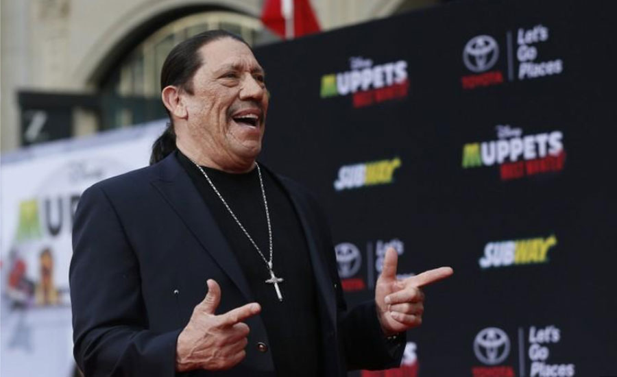 Danny of Machete fame pulls young boy from overturned car