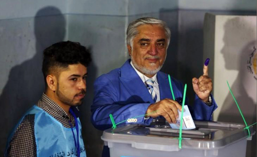Afghan voters defy attacks, delays to vote for president
