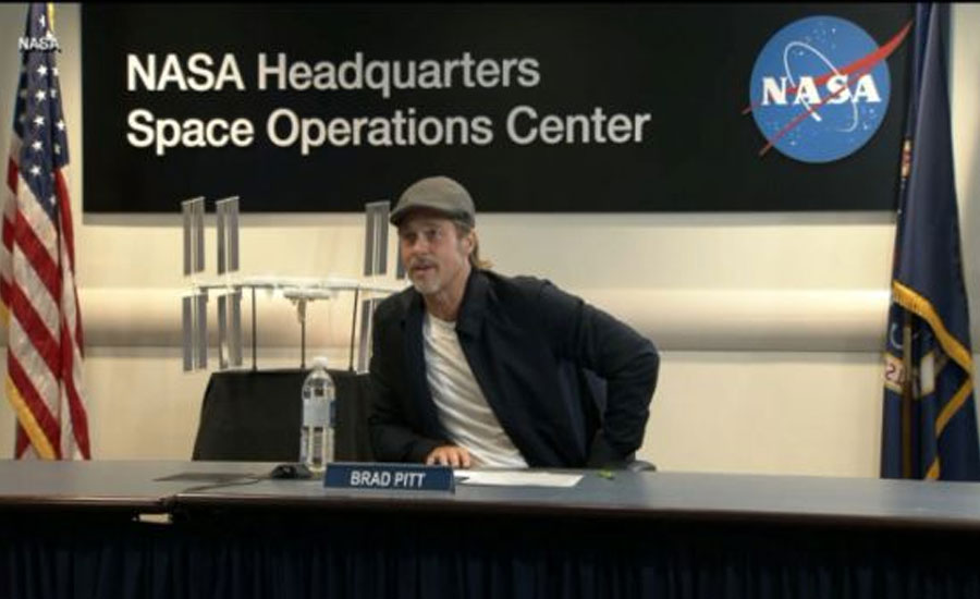 Who calls the tunes in space? Brad Pitt asks NASA astronaut