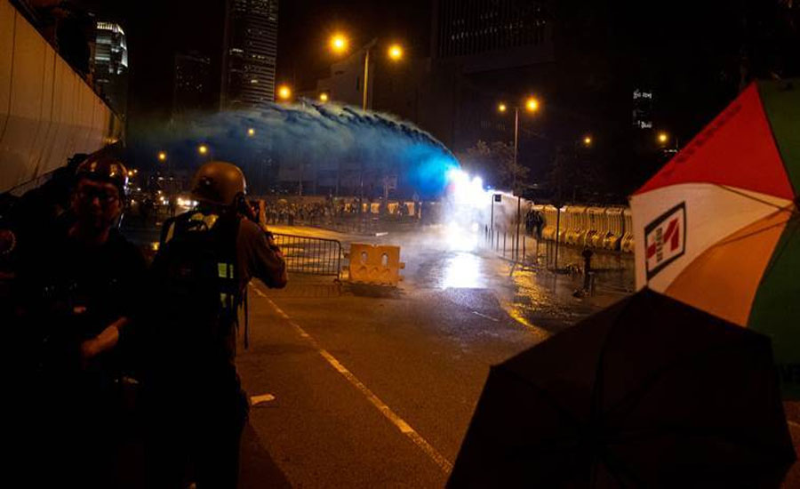 Hong Kong police target violent protesters as China National Day nears