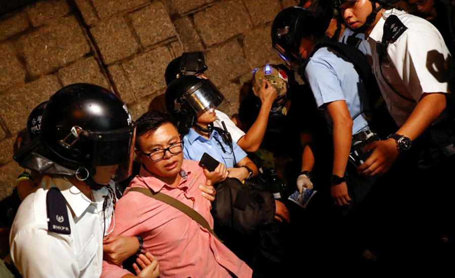Hong Kong police fire beanbag during clashes with protesters